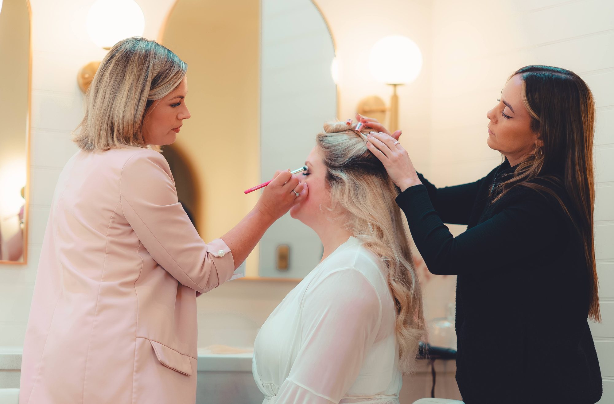 Rebecca and Piggy Rose Beauty working together on wedding hair and makeup for a bride