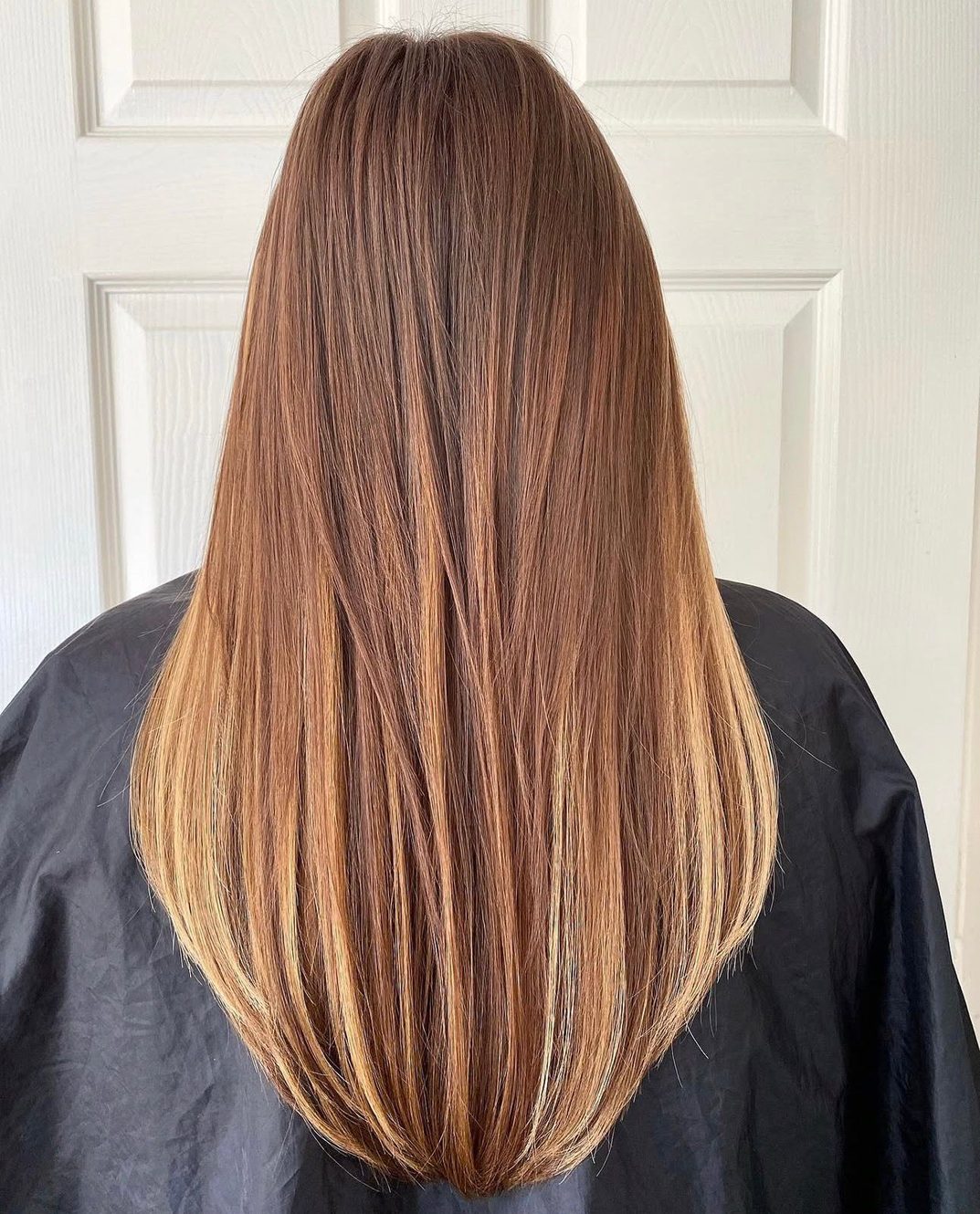 Long sleek brown hair with natural-looking extensions by Lucent Hair