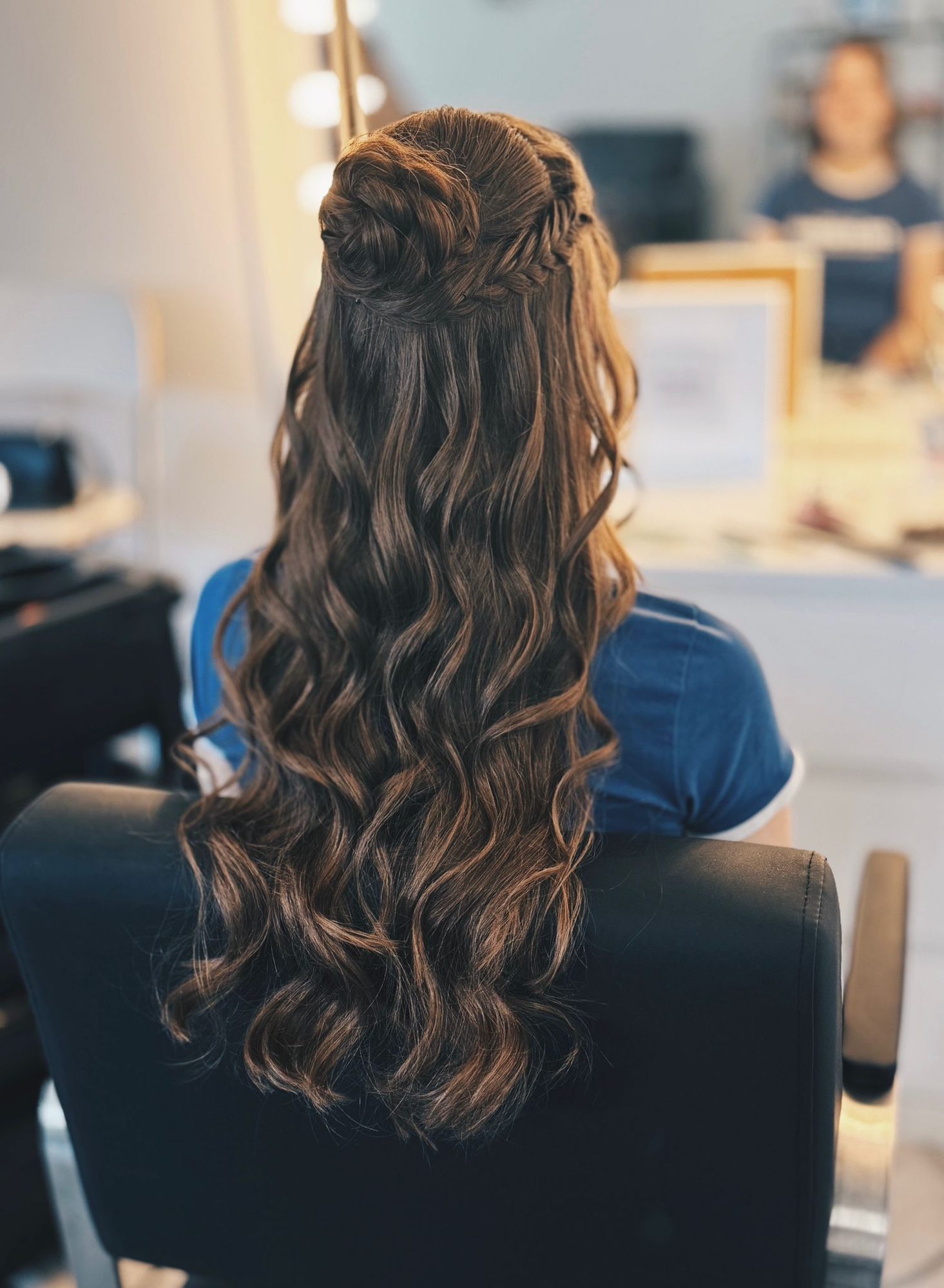 Long wavy half-up hairstyle with braid detail by Lucent Hair Cambridgeshire